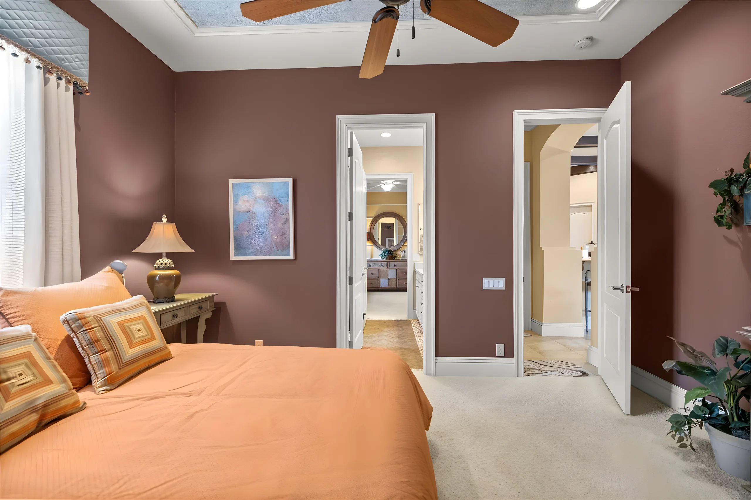 3rd bedroom with the doors to the jack and jill bathroom and the hall