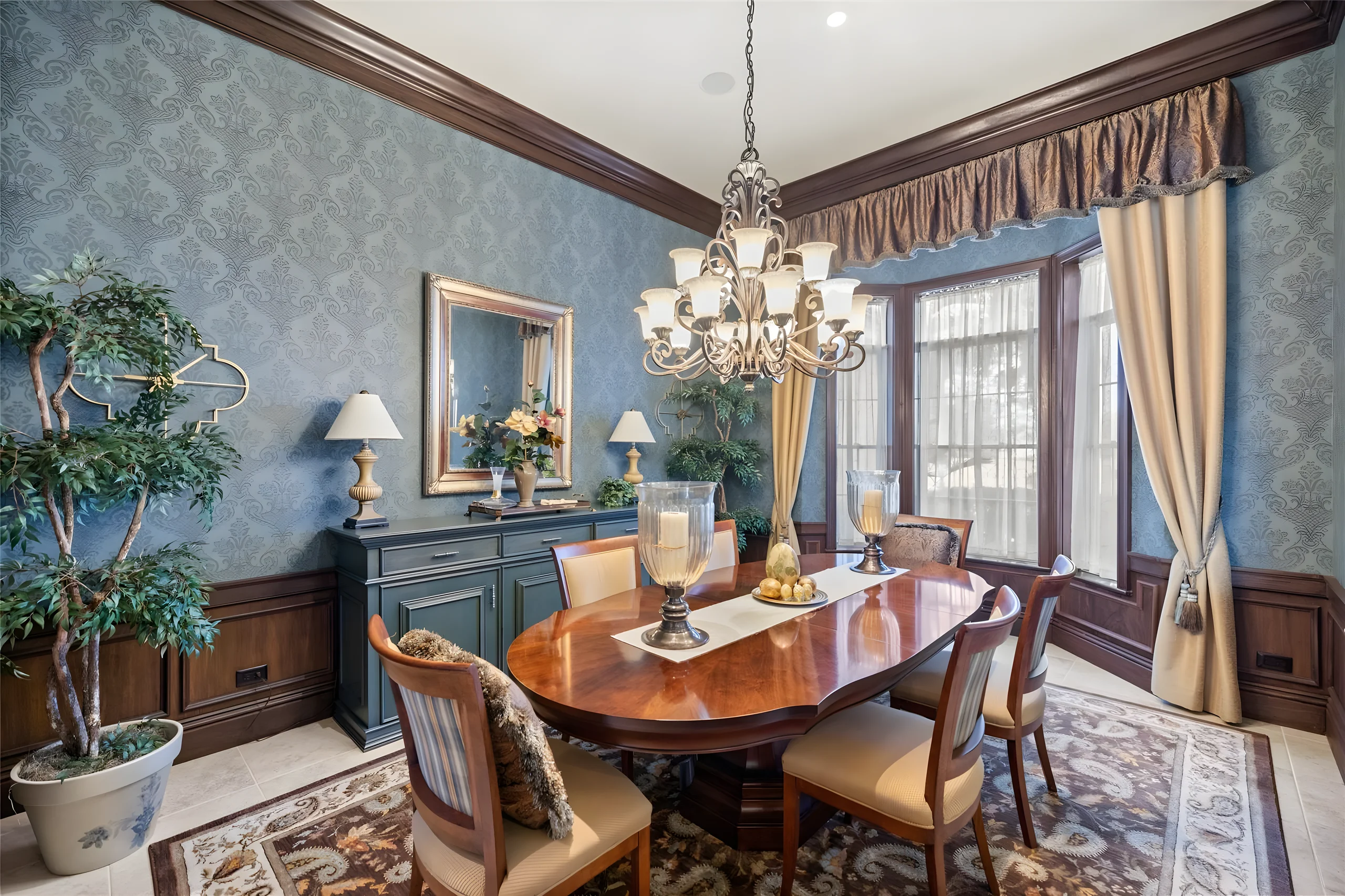 Formal dining room from the corner, with the bay window, the sideboard and the chandelier